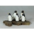 A STUNNING GROUP OF BLACK & WHITE PENGUINS ON A WOODEN BASE - BID NOW!!!!