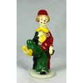 CLOWN FIGURINE HOLDING A BOOK WITH HIS FOOT - BID NOW!!!