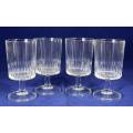 A SET OF FOUR CRYSTAL WINE GLASSES - BID NOW!!