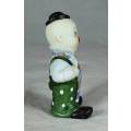 CERAMIC CLOWN IN A GREEN POLKA DOT JUMP SUIT AND TIE - BID NOW!!