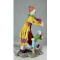 TWO VERY MULTI COLORED CLOWNS ON A STAND - BID NOW!!