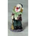MOLDED CLOWN ON A STAND HOLDING A BROOM - BID NOW!!