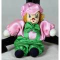 PORCERLAIN AND CLOTH CLOWN DRESSED IN GREEN AND PINK