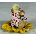 CERAMIC CLOWN SITTING IN A SUNFLOWER HOLDING A BUNCH OF ROSES (LOVELY) -BID NOW !!!