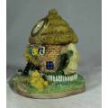 CERAMIC HOUSE WITH A CLOCK AND BEARS (ENCHANTING)-BID NOW