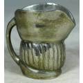 SMALL METAL JUG WITH FACE -BID NOW