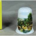 LOVELY PORCELAIN THIMBLE (BRIDGE COVERED BY TREES)-BID NOW!