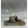 STUNNING COLLECTABLE MUD MEN-MAN ON A RAFT WITH A FISH-BID NOW!!!