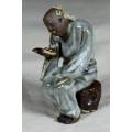 STUNNING COLLECTABLE MUD MEN-SEATED MAN READING ON A ROCK BID NOW!!!