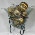 LARGE GLASS CENTRE PIECE ON A METAL STAND WITH LARGE ROUND SEED BALLS-BID NOW!