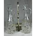 LOVELY PAIR OF VINEGAR AND OIL CONTAINERS IN A SILVER PLATED HOLDER-BID NOW!