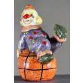 Small Clown Figurine - Sitting on a Large Ball - BID NOW