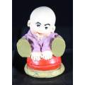 Little Monk Sitting on Red Pillow - Bid Now!!!