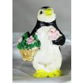 Vintage Molded Penguin Holding Flowers - Bid Now!