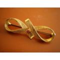Vintage Art Deco Brooch In Gold Toned Metal In Form Of A Bow Tie With Red Glass Stone