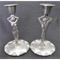 A pair of candlesticks by Carrol Boyes