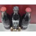 Set of Sealed Coca-Cola Bottles