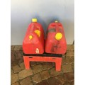 TWO 10 LT PLASTIC FUEL CONTAINERS AND A TOOL SEAT