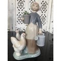 A LLADRO Porcelain Figurine, Country Girl with Plant & Water Can in Hands Ducks at feet.