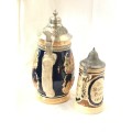 Set of 2 Graduating German Pottery Beer Steins Complete with pewter Lids.