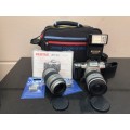 PENTAX MZ-50 35mm SLR FILM CAMERA WITH EXTRA LENS MANUALS FLASH AND BENNETTON CAMERA BAG