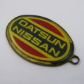 Vintage Datsun Nissan keyring holder - some damage