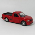 Jada Toys 1999 F-150 SVT Lighting model car - scale 1/32