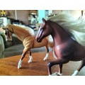 Two Plastic Toy Horses