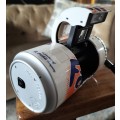 Vintage plastic camera in shape of Fanta Orange can