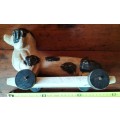 Vintage toy - Wooden pull along dog in wheels
