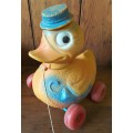 Vintage plastic pull-along duck on wheels