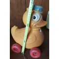 Vintage plastic pull-along duck on wheels