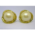 Lovely pair of Vintage Clip on Earrings. Large Faux Marbe set in gold color ribbon.