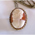 Shell Cameo pendant/brooch with chain. 2.5 cms x 3 cms. Signed PS CO 1/20 10K GF