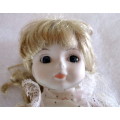 Vintage Soft Body Porcelain Doll. Very Beautiful with Original Clothes. Ons Stand.300mm high.