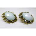 Vintage faceted cat eye light blue and clear stone earrings. 25mm.