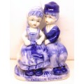 Vintage Dutch Delfts Blue Girl And Boy Sitting On Bench Hand Painted Figurine. Holland Overprint.