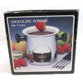 Swiss Chocolate Fondue Pot with 4 forks. Still inoriginal box, never been used.