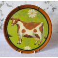 Terracotta hand painted glazed Cheese Plate depicting a happy cow. 200mm diameter.