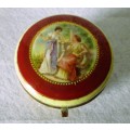 German Porcelain Round Trinket Box with hand painted gilt, brass hinge and rim. Pastoral Scene.