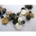 Lovely Mother of Pearl discs with black semi precious stone necklace. 90cm.