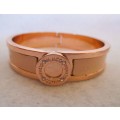 Designers Mimco Rose Gold Solid Hinged Bangle. Brass with a rose gold coloured plating and leather.