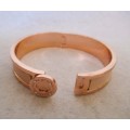 Designers Mimco Rose Gold Solid Hinged Bangle. Brass with a rose gold coloured plating and leather.