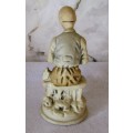 Vintage Bisque Porcelain Old Man Sitting on Bench with Cane/Pipe. 165mm hgh.