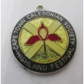 Vintage Cape Town Caledonian Society Highland festival enameled.