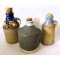 Lot of 3 Vintage Stoneware Jugs with cork. bigger 120mm high.