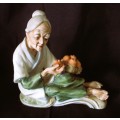 Vintage Ceramic Figurine, old lady with oranges in basket. Lovely item. 160x160mm