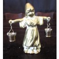 Antique brass figurine girl carrying two milk baskets. Marked.