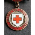 Enameled British Red Cross Society Badge awarded to Jessie Symonds no. 05305 Country of Surrey
