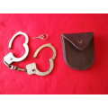 SA POLICE -  PAIR HANDCUFFS + KEY + LEATHER BELT POUCH - WORKING BUT SOME PITTING           (4153)